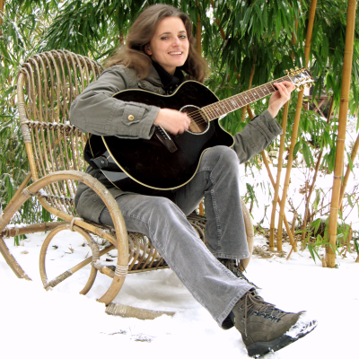 beloved-child plays guitar in the snow 